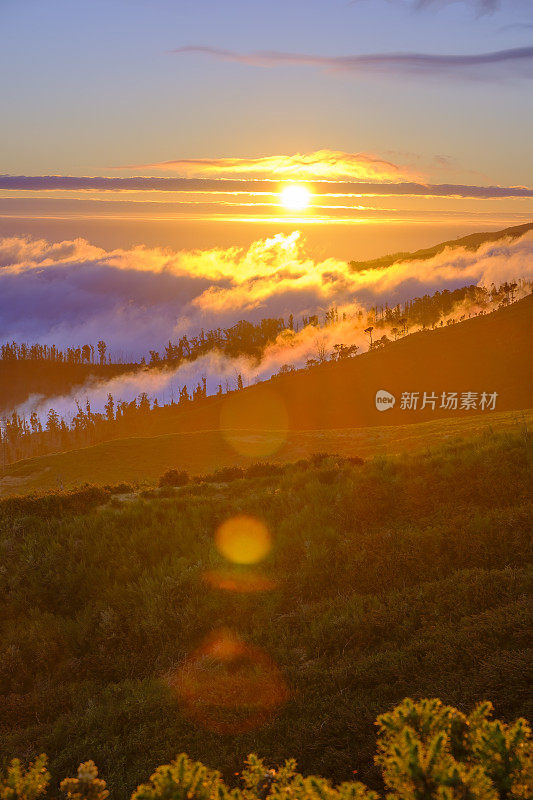 Clouds over the mountains near Rabaçal on Madeira island during sunset